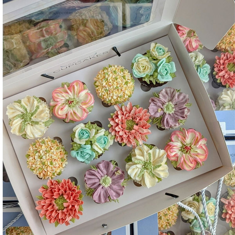 handpiped floral cupcakes in various shades of pinks and whites, using low calorie buttercream developed by us. Available in singapore for pickup and delivery