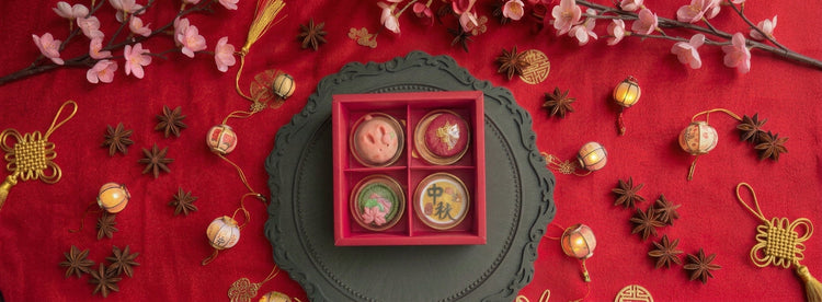 "Mid-Autumn Shortbread Gift Boxes" hero image — red gift box of four mid-autumn cookies on a dark ornate plate, styled with red fabric, star anise and florals.