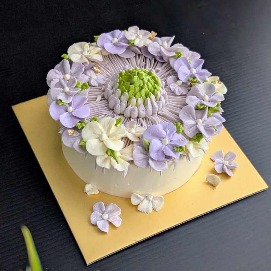 round-shaped floral cake with hand-piped buttercream flowers, healthy low-sugar birthday cake Singapore