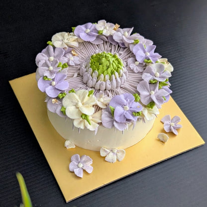 round-shaped floral cake with hand-piped buttercream flowers, healthy low-sugar birthday cake Singapore