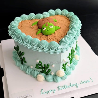 heart cake with a cute sculpted turtle cookie on a chocolate bark base, healthy low-sugar birthday cake