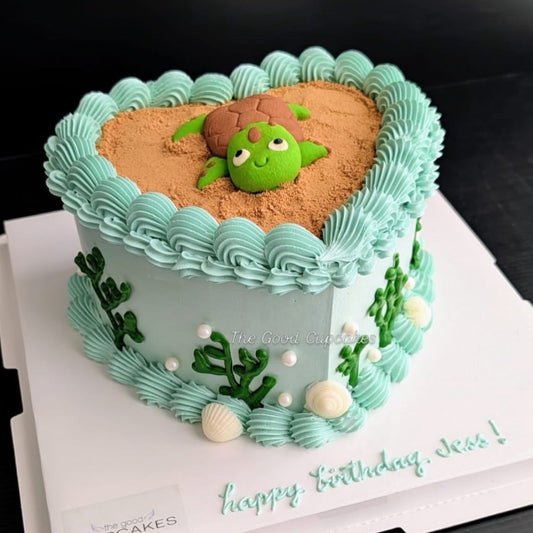 heart cake with a cute sculpted turtle cookie on a chocolate bark base, healthy low-sugar birthday cake