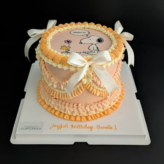 Round vintage cartoon-inspired cake topped with hand-piped buttercream roses, healthy low-calorie floral birthday cake