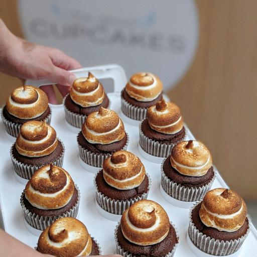 Tray of s'mores cupcakes with swirled toasted marshmallow frosting on chocolate base, set of 6 available