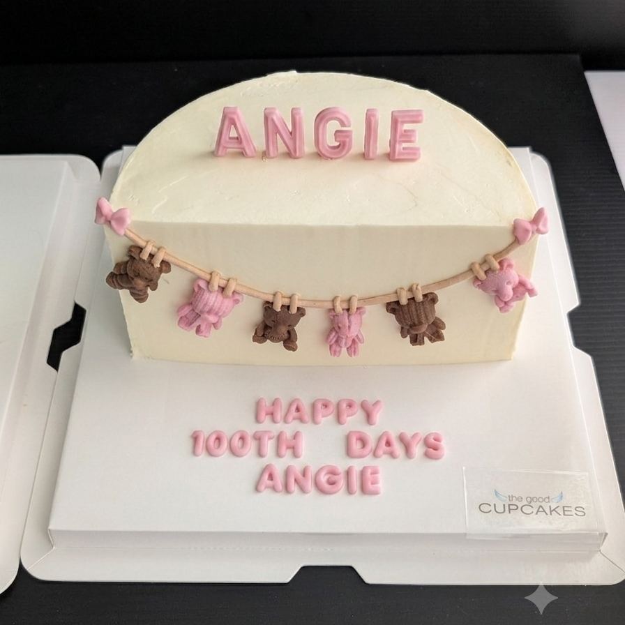 100-day baby celebration cake with cream buttercream, hand-piped teddy bear bunting in teal and brown, custom name topper, low-sugar Singapore