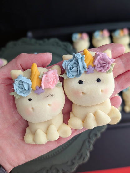 Group of mini unicorn-shaped cakes with pastel rainbow icing, arranged together — The Good Cupcakes Singapore