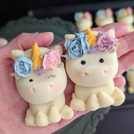 Close-up of hand-painted Rainbow Unicorn shortbread cookies with pastel floral crowns, low sugar — The Good Cupcakes Singapore