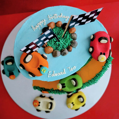 Car-themed birthday cake with baby blue buttercream, toy racing cars and road details, low calorie, no fondant