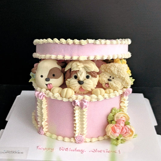 Gift box with 3 puppies in a hand-piped white and pink cake gift box, healthy low-sugar birthday cake