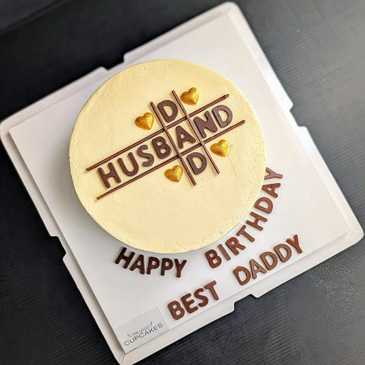 Husband Dad birthday cake with chocolate piped lettering grid design and gold heart sprinkles on cream buttercream, custom men's cake Singapore