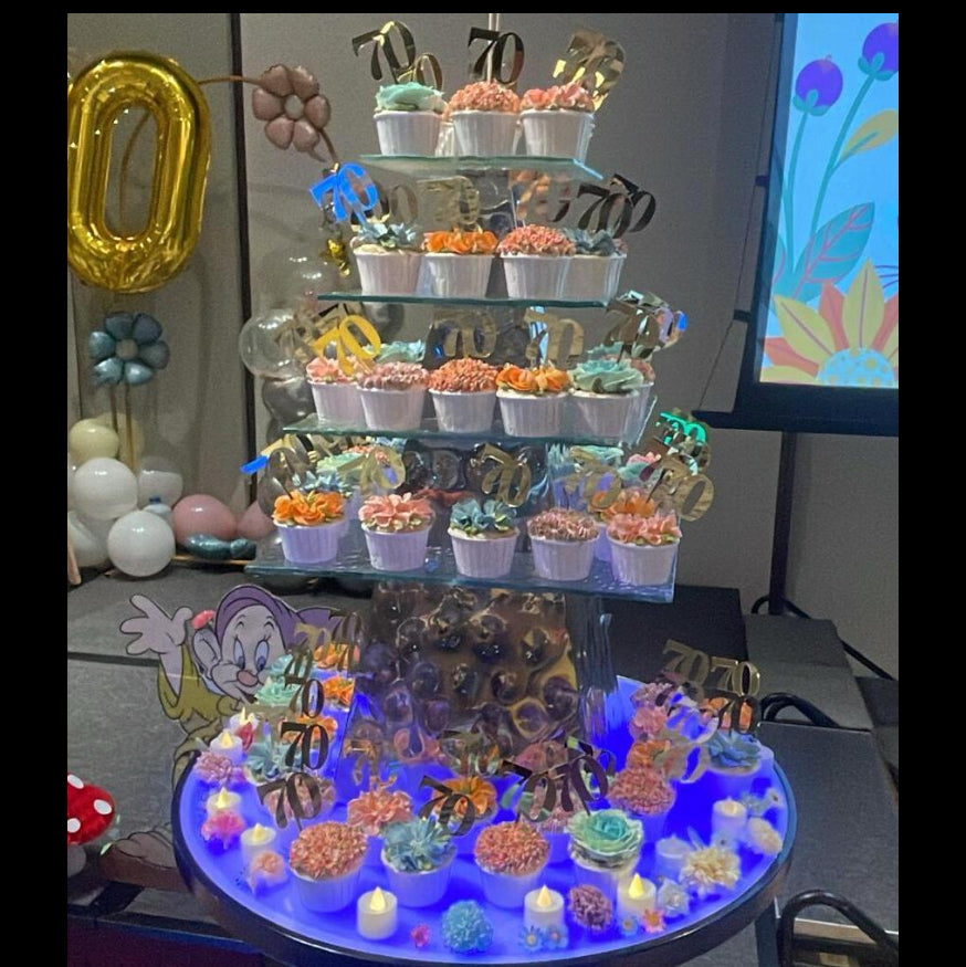 Tiered floral cupcake tower with pastel buttercream flowers and gold 70 toppers, created for Mitsubishi Electric’s 70th anniversary celebration at SICC.