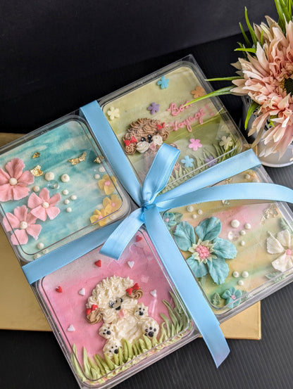 Floral bento boxed cakes with hand-piped buttercream flowers on pastel painted backgrounds, healthy low-sugar mini cakes Singapore