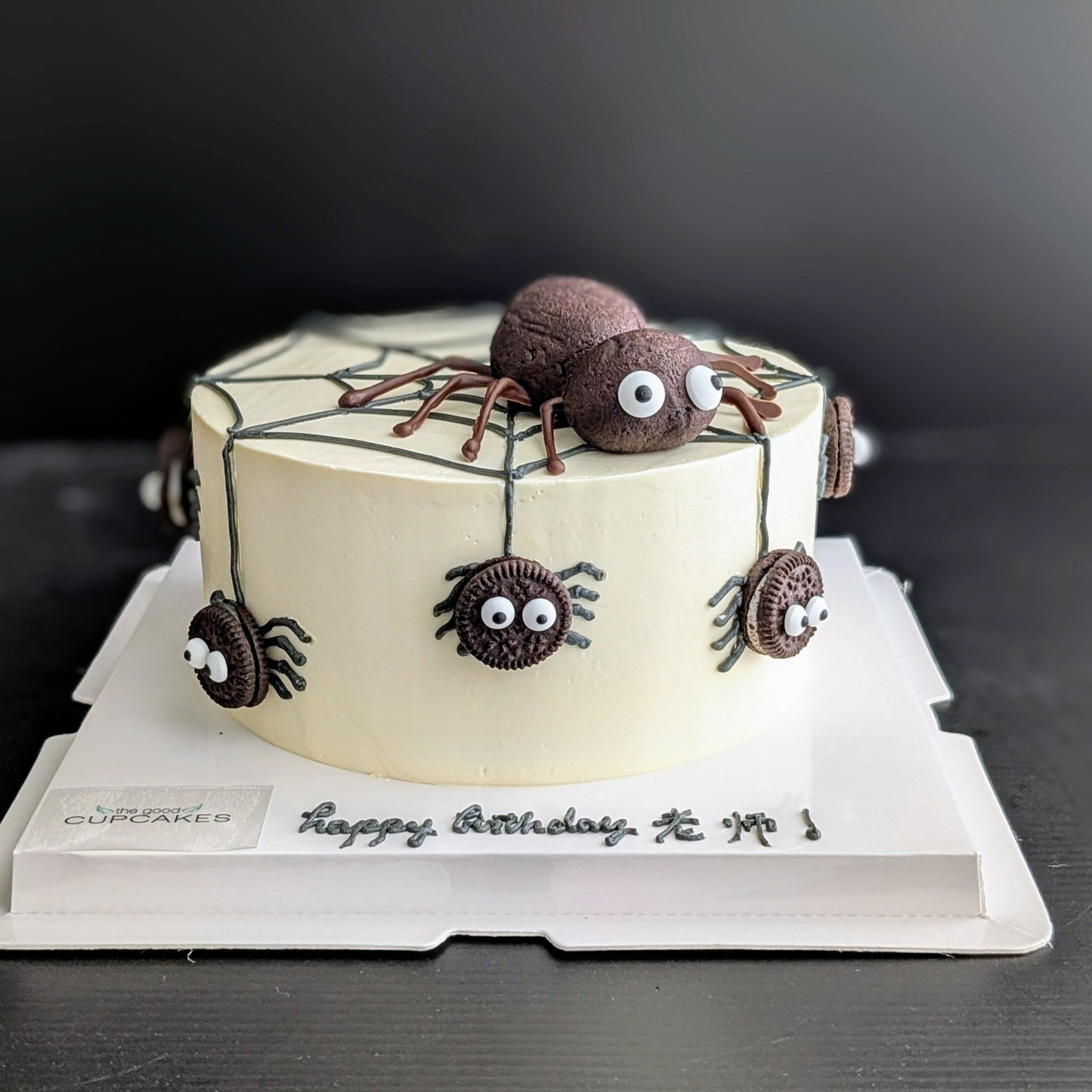 Spider cake with Oreo cookie spiders, buttercream spiderweb, and chocolate cake spider topper, low-sugar Halloween birthday cake Singapore