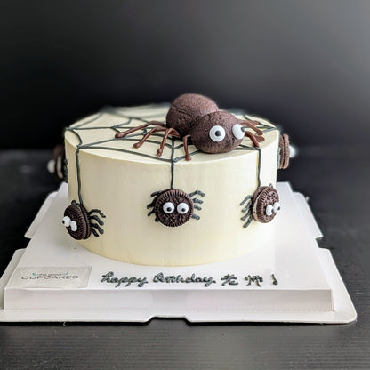 Spider cake with Oreo cookie spiders, buttercream spiderweb, and chocolate cake spider topper, low-sugar Halloween birthday cake Singapore