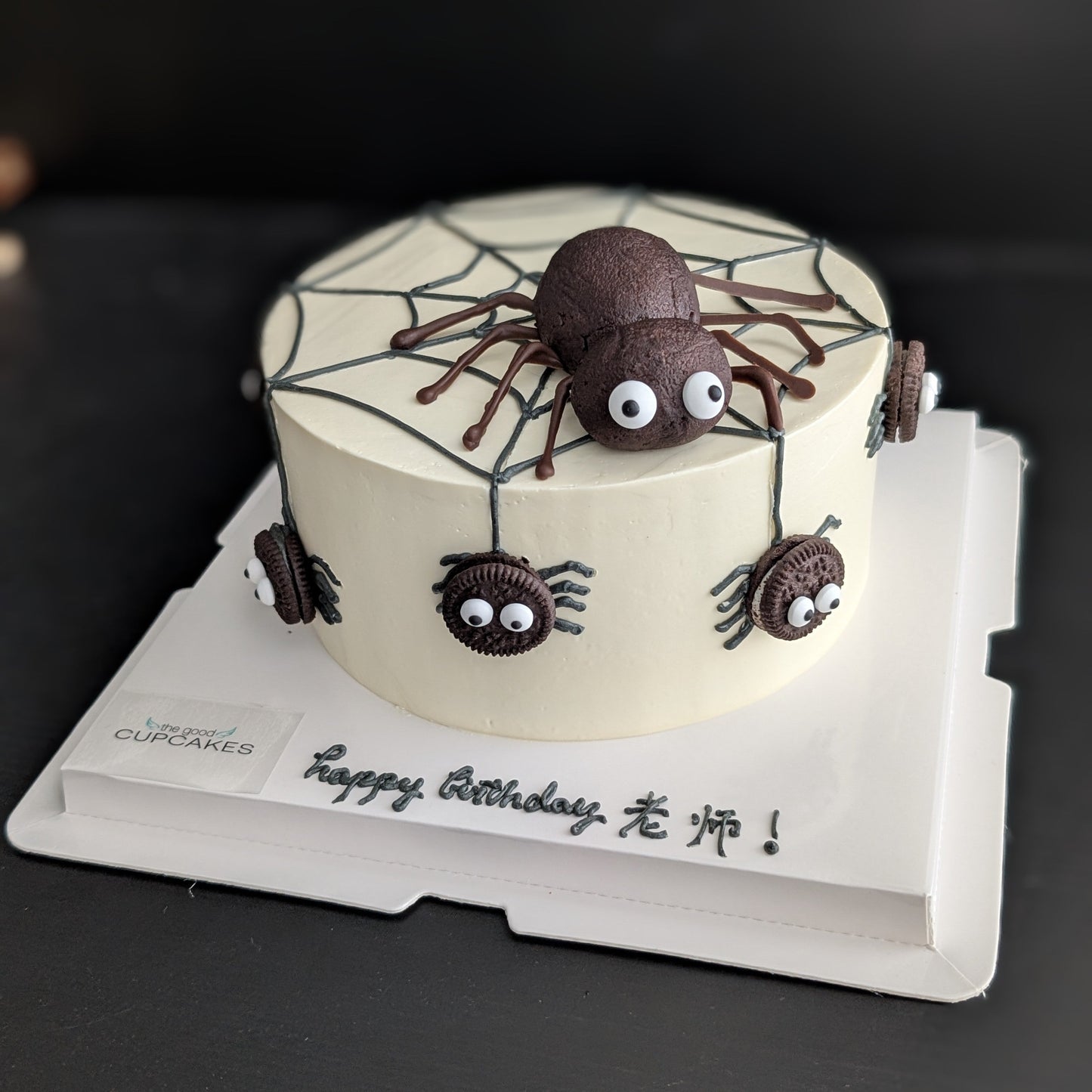 Spider cake with Oreo cookie spiders, buttercream spiderweb, and chocolate cake spider topper, low-sugar Halloween birthday cake Singapore