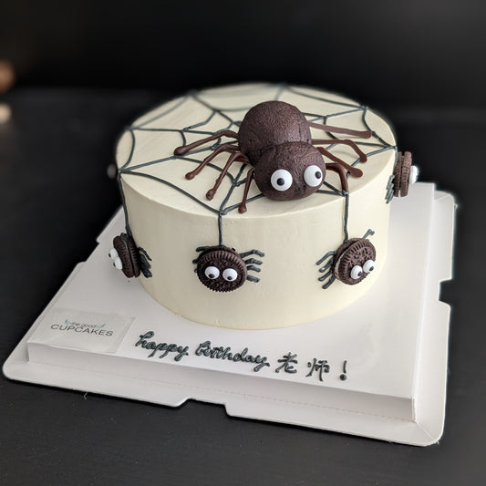 Spider cake with Oreo cookie spiders, buttercream spiderweb, and chocolate cake spider topper, low-sugar Halloween birthday cake Singapore