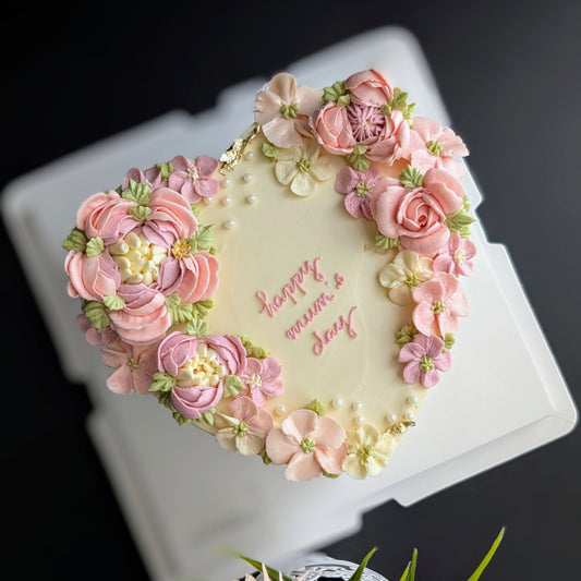 Heart-shaped floral cake with hand-piped buttercream flowers, healthy low-sugar birthday cake Singapore