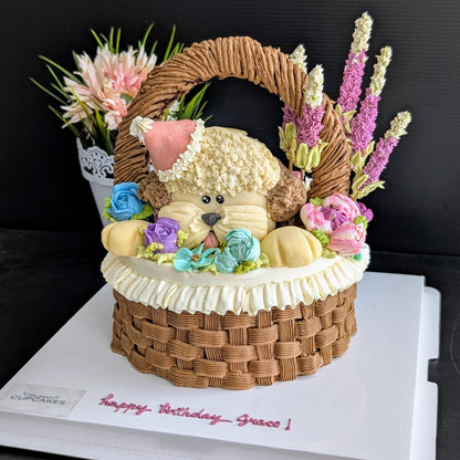Floral basket cake with a sculpted puppy surrounded by hand-piped purple, pink and yellow flowers healthy low-sugar birthday cake