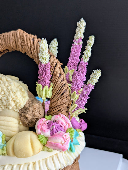 Floral basket cake with a sculpted puppy surrounded by hand-piped purple, pink and yellow flowers healthy low-sugar birthday cake