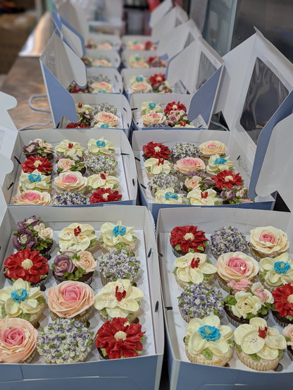 Bulk floral cupcake gift boxes for corporate events, hand-piped buttercream flowers, 150 calories each, The Good Cupcakes Singapore
