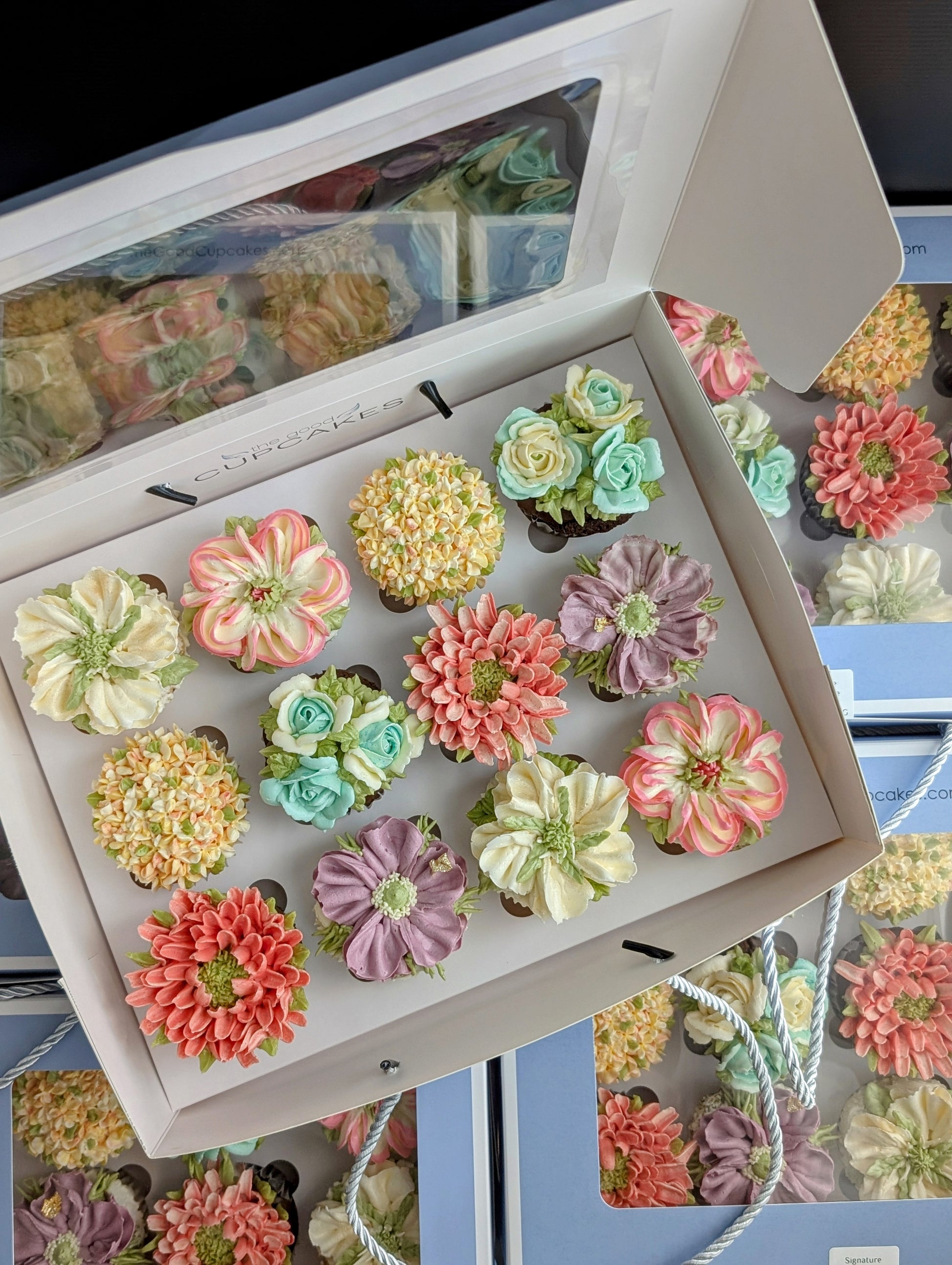 Bulk floral cupcake gift boxes for corporate events, hand-piped buttercream flowers, 150 calories each, The Good Cupcakes Singapore
