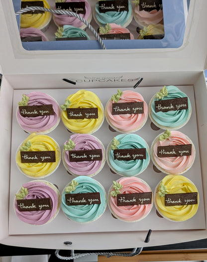 Box of 12 pastel rose buttercream cupcakes with handcrafted chocolate "thank you" plaques in purple, yellow, pink and blue, The Good Cupcakes Singapore

