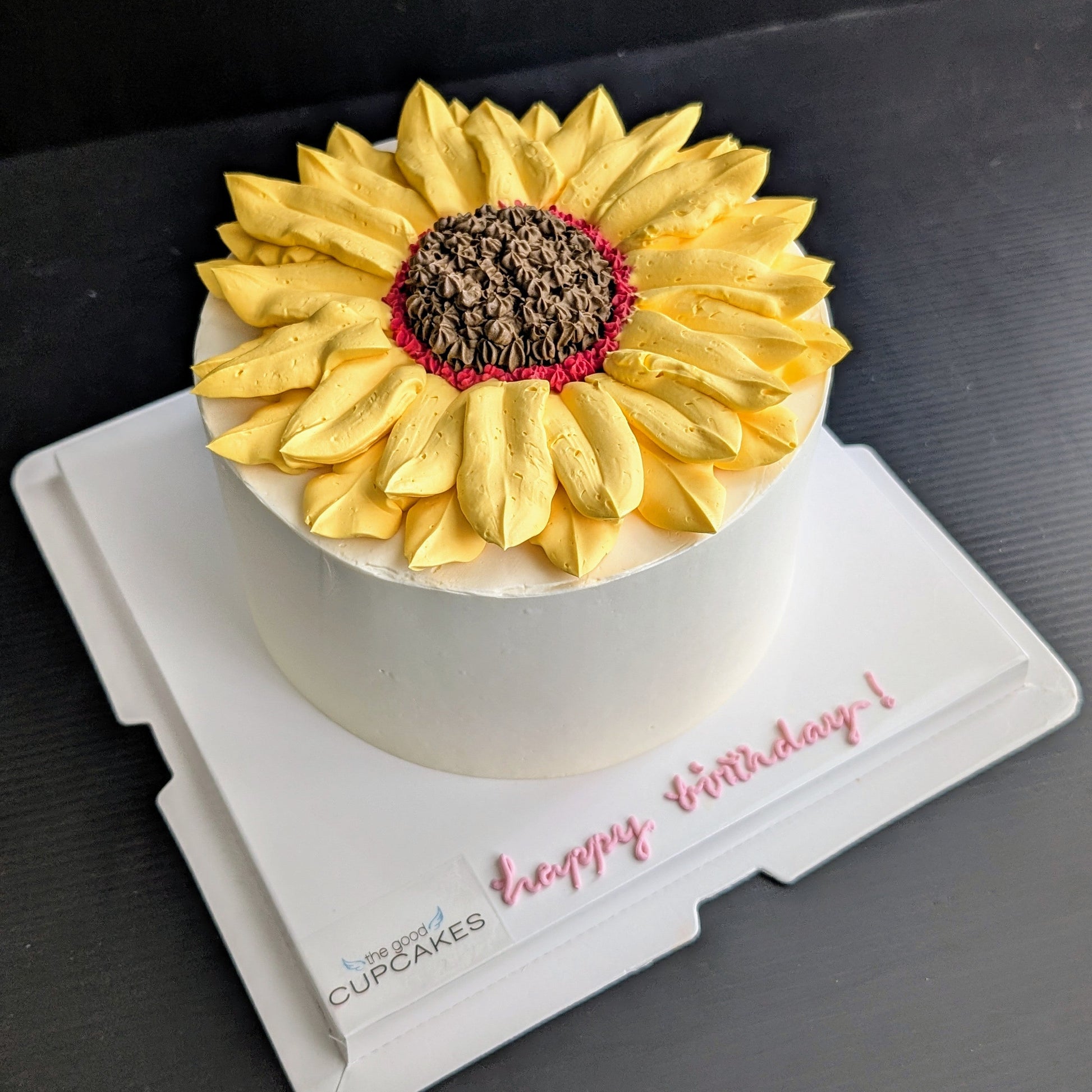 Sunflower cake with hand-piped yellow buttercream petals and chocolate centre, healthy low-sugar birthday cake Singapore