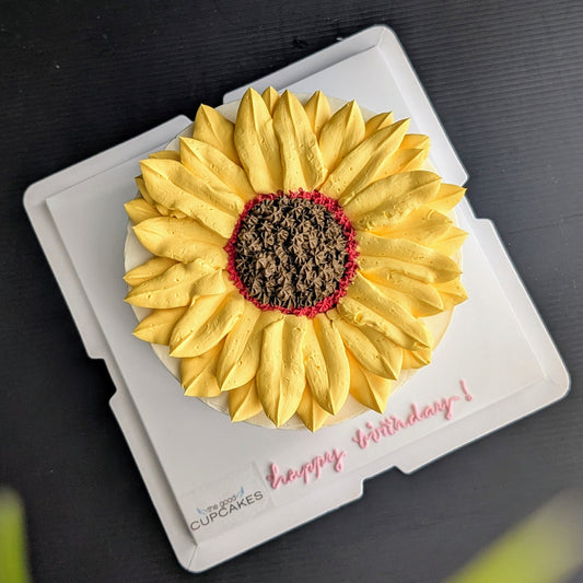 Sunflower cake with hand-piped yellow buttercream petals and chocolate centre, healthy low-sugar birthday cake Singapore