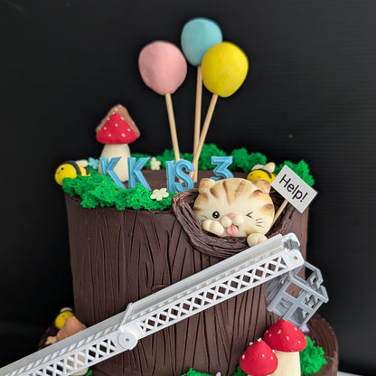 Fire Engine Cake - two tier chocolate tree bark cake with cookie mushrooms, bees, cat and fire engine ladder