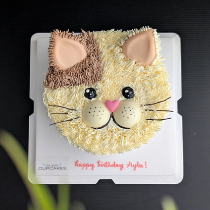 Cat face birthday cake with cream and brown buttercream fur, pink heart nose and ears, whiskers, low-sugar cake Singapore