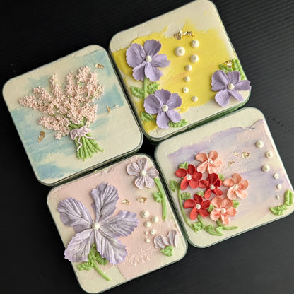 Floral bento boxed cakes with hand-piped buttercream flowers on pastel painted backgrounds, healthy low-sugar mini cakes Singapore