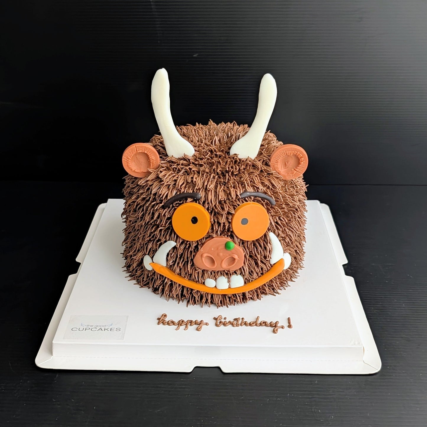 Whimsical forest monster cake with hand-piped buttercream and googly eyes, The Good Cupcakes Singapore