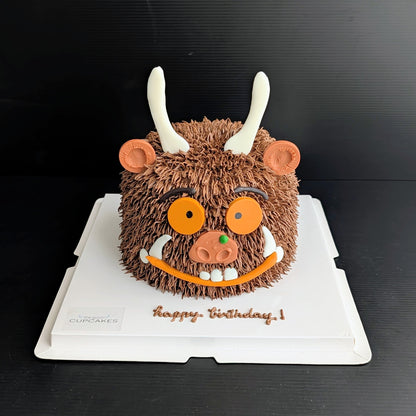 Whimsical forest monster cake with hand-piped buttercream and googly eyes, The Good Cupcakes Singapore