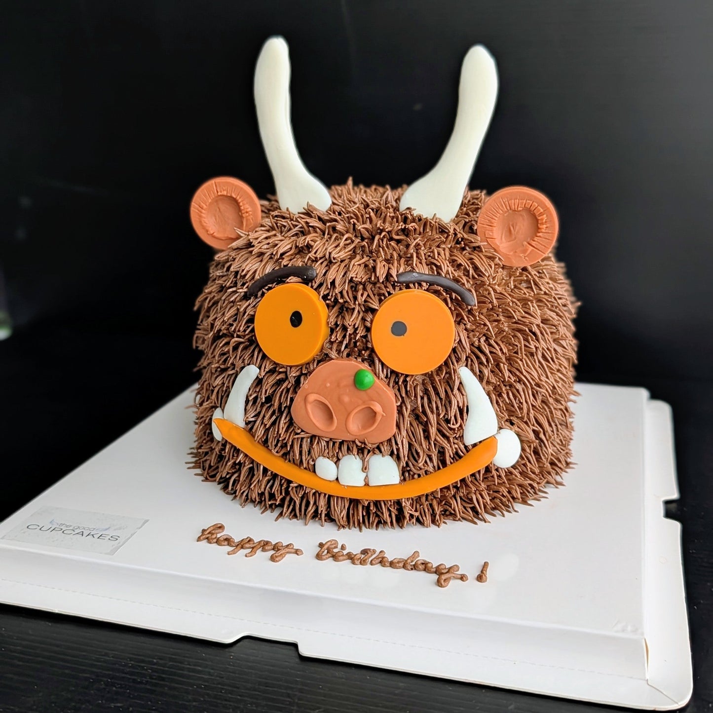 Whimsical forest monster cake with hand-piped buttercream and googly eyes, The Good Cupcakes Singapore