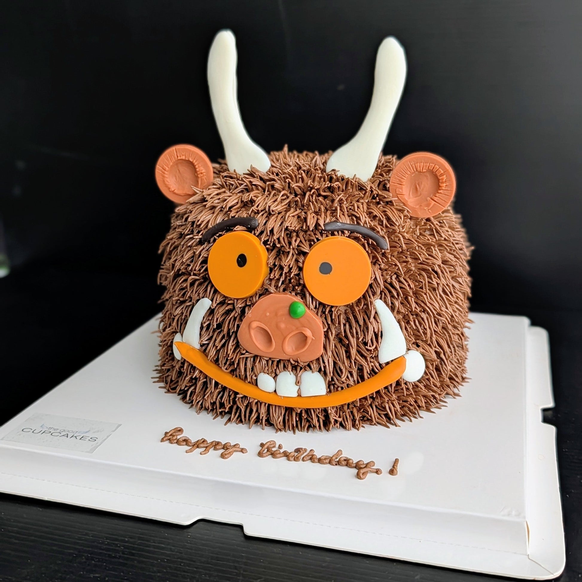 Whimsical forest monster cake with hand-piped buttercream and googly eyes, The Good Cupcakes Singapore