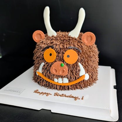 Whimsical forest monster cake with hand-piped buttercream and googly eyes, The Good Cupcakes Singapore
