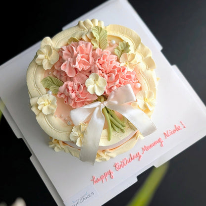 Round cake topped with hand-piped buttercream carnations, healthy low-calorie floral birthday cake