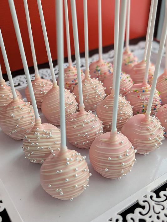 Cake pops with white chocolate drizzle and silver pearl sprinkles – low-calorie handcrafted treats by The Good Cupcakes