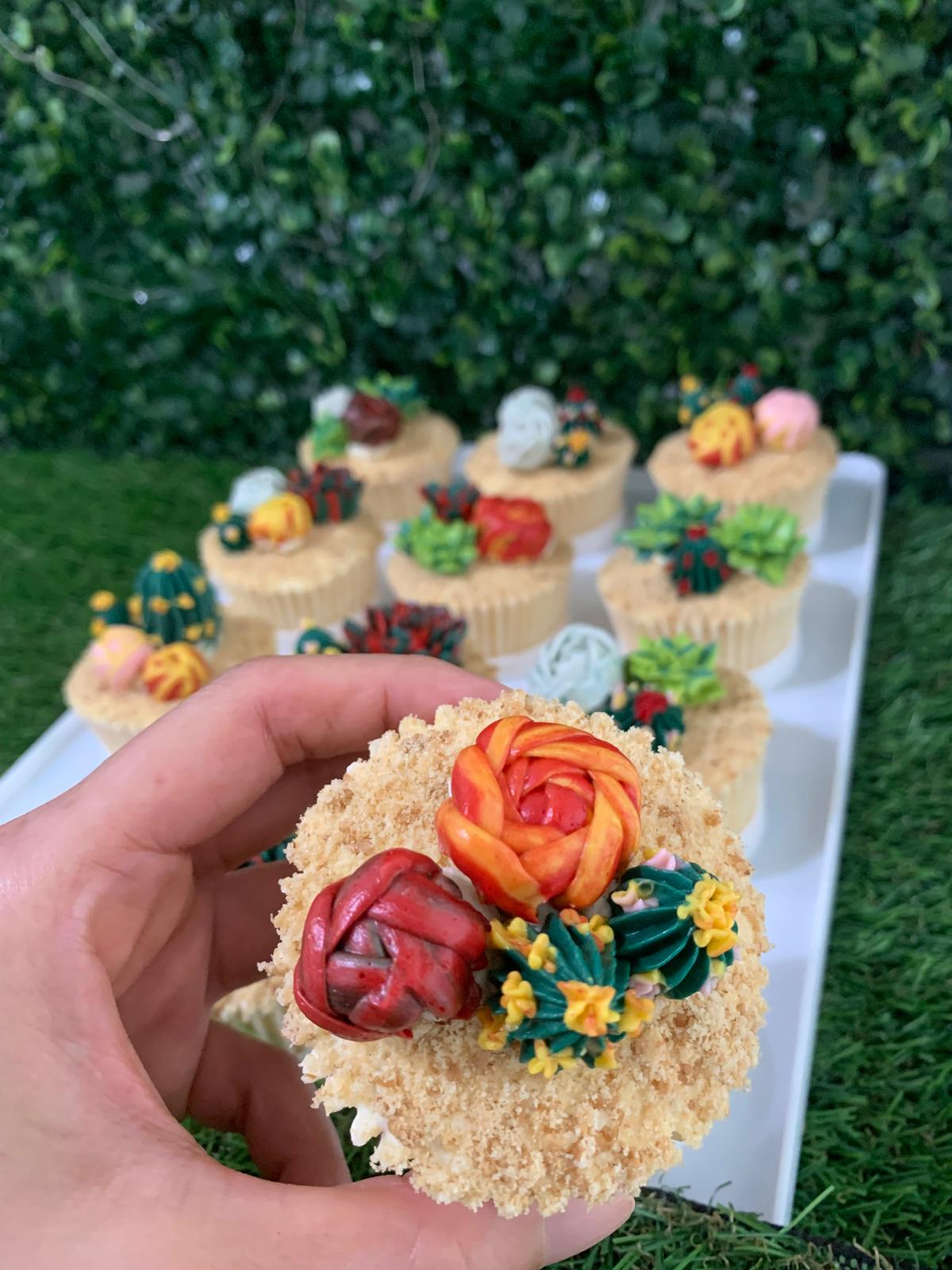 Close-up of hand-piped succulent cupcake, red and orange rose buttercream detail — The Good Cupcakes Singapore