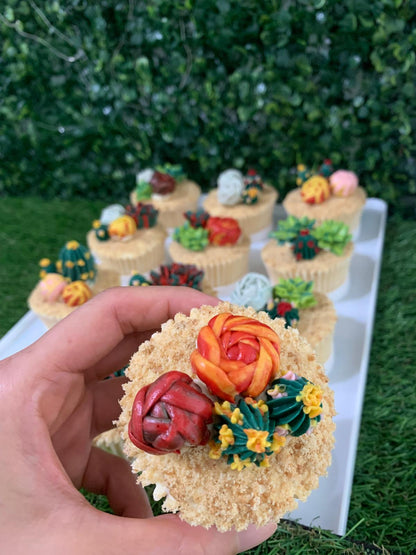 Close-up of hand-piped succulent cupcake, red and orange rose buttercream detail — The Good Cupcakes Singapore