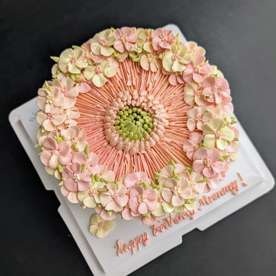 pink round-shaped floral cake with hand-piped buttercream flowers, healthy low-sugar birthday cake Singapore