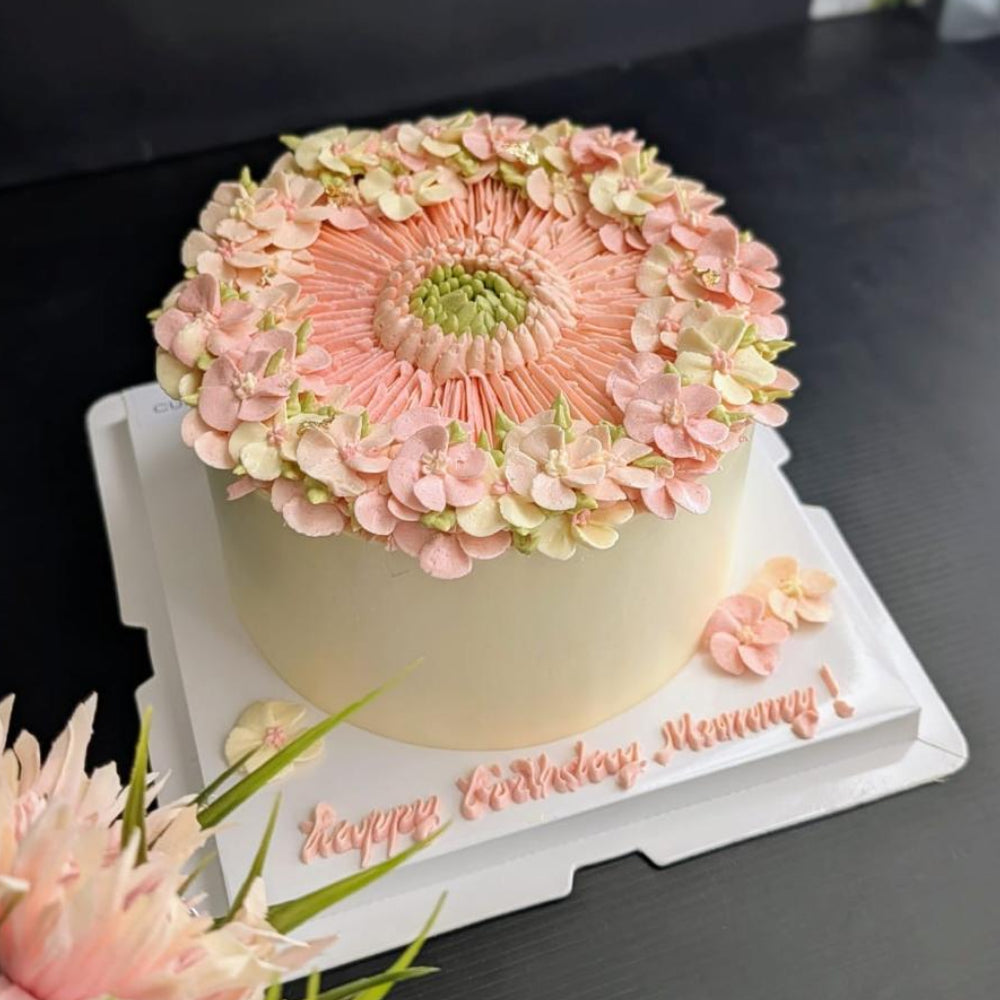 pink round-shaped floral cake with hand-piped buttercream flowers, healthy low-sugar birthday cake Singapore