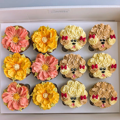 Box of 12 cupcakes with 6 hand-piped puppy face cupcakes in white, brown and grey buttercream and 6 hand-piped floral cupcakes in pink and yellow, The Good Cupcakes Singapore
