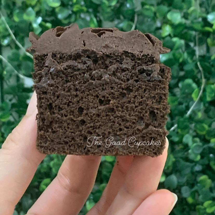 Cross-section of a chocolate cupcake showing moist dark chocolate sponge, only 150 calories per cupcake