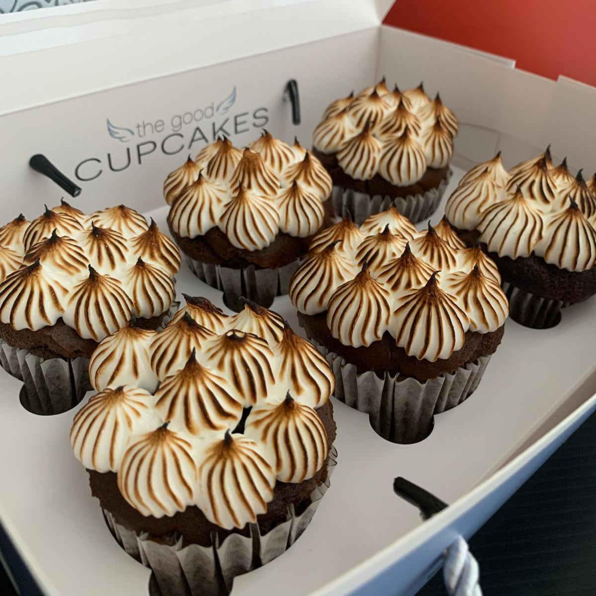Box of 6 choco-berry meringue cupcakes with tall torched meringue topping in The Good Cupcakes gift box