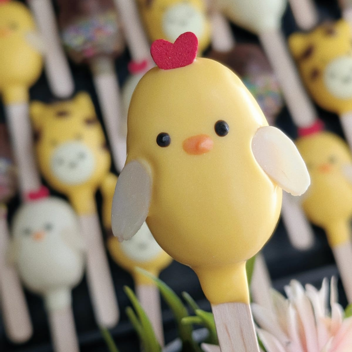 Chick cakesicle — yellow chick with red heart and white wings