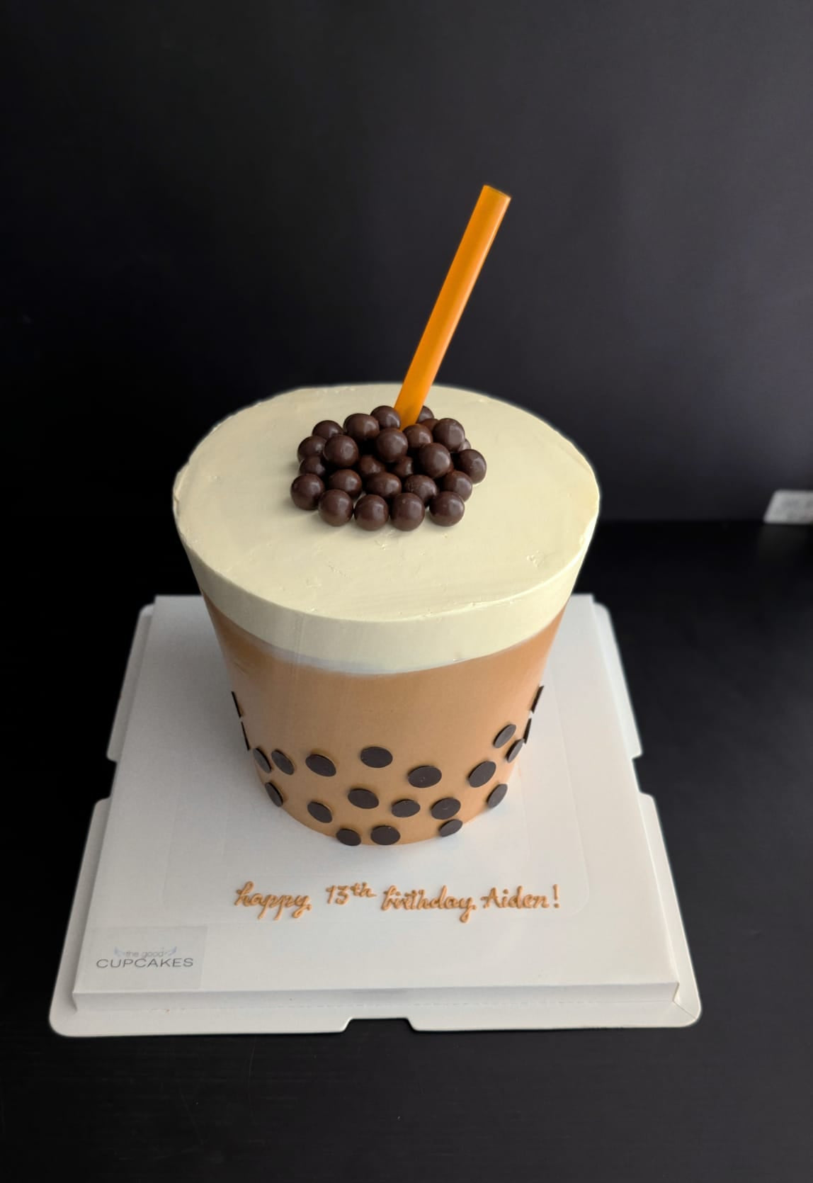 Bubble tea boba cake with caramel brown buttercream, chocolate pearl topping and straw, novelty birthday cake Singapore