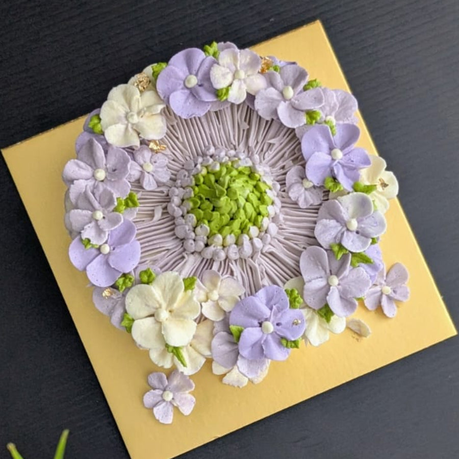 round-shaped floral cake with hand-piped buttercream flowers, healthy low-sugar birthday cake Singapore