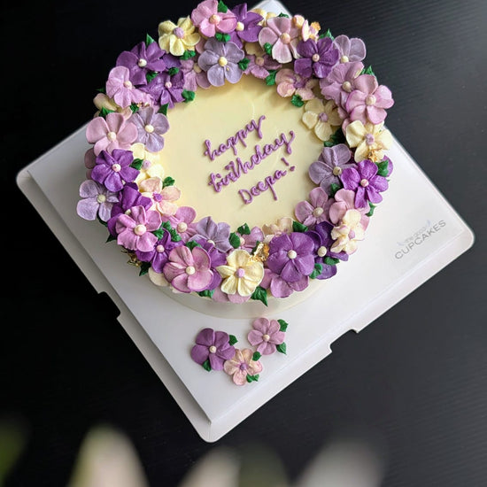 Wreath floral cake with hand-piped pink, white and blue buttercream roses, healthy low-sugar birthday cake Singapore