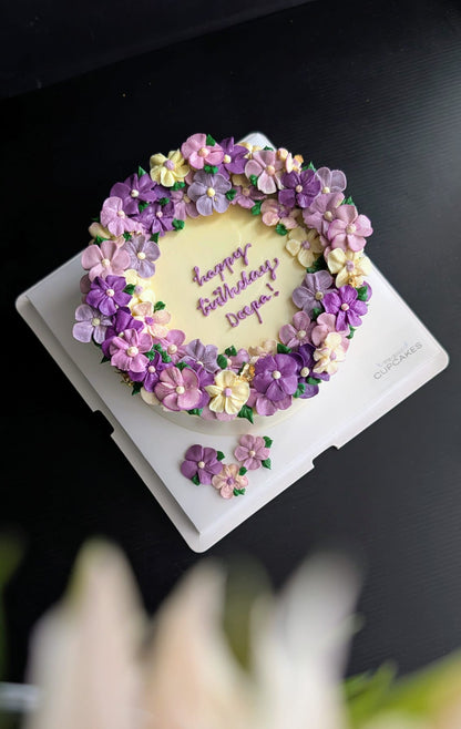 Wreath floral cake with hand-piped pink, white and blue buttercream roses, healthy low-sugar birthday cake Singapore